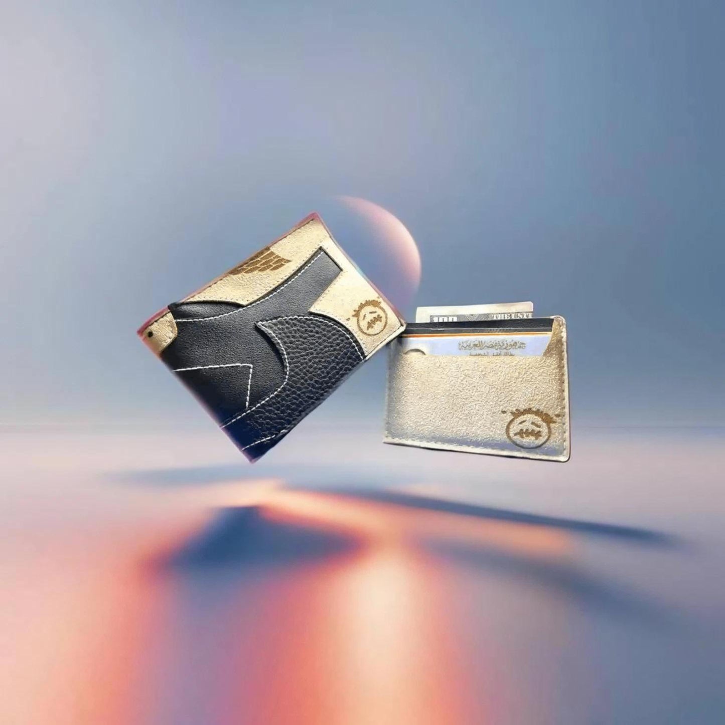 Two wallets, one black and one gold, on a gradient background